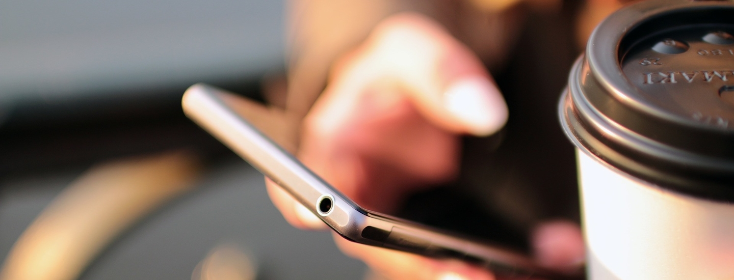 Hands coffee smartphone technology