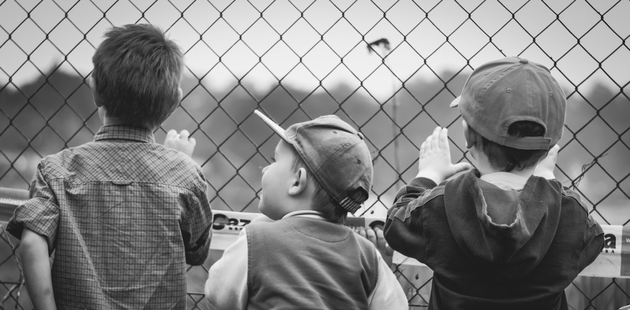 Big children looking for or at something