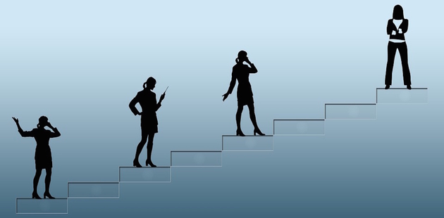 Big ambition woman going up a ladder