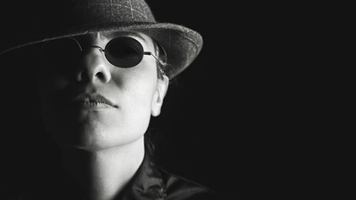 Middle person sunglasses dark hat 1